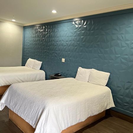 The Symphony Inn & Suites Houston Extérieur photo